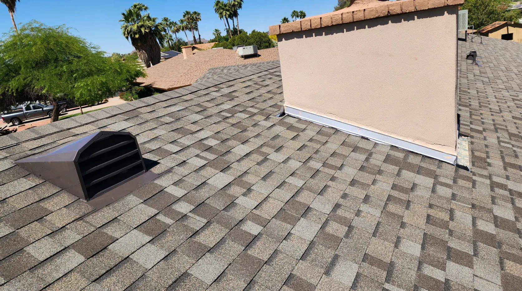 Photo: shingle detail at the hip and ridge on a finished roof